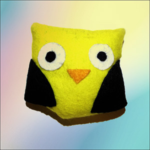 Graphic shows a stuffed owl in Hufflepuff colors of black and yellow.