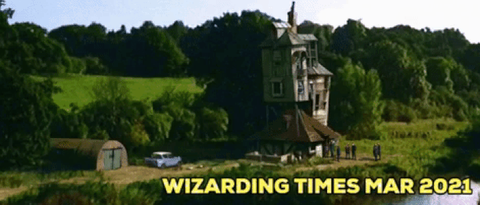 A view of The Burrow, showing the house, the Ford Anglia, and a bit of the river and hills behind it, with 'Wizarding Times Mar 2021' in the lower right corner